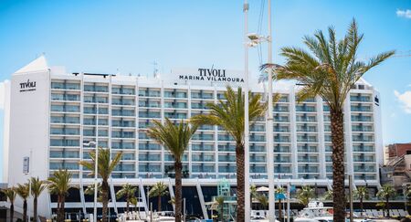 Vilamoura, Portugal - May 1, 2018: facade of a luxury tourist building near the marina on a spring dayのeditorial素材