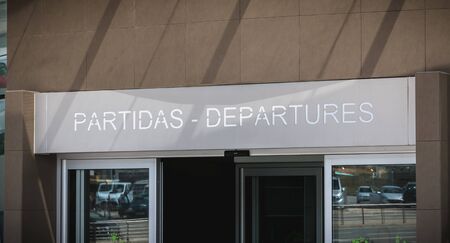 Faro, Portugal - May 3, 2018: Exterior view of Faro International Airport where passengers are walking with their suitcases on a spring dayのeditorial素材