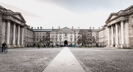 Dublin, Ireland - February 11, 2019: People walking in the courtyard of Trinity College in the city center on a winter dayのeditorial素材