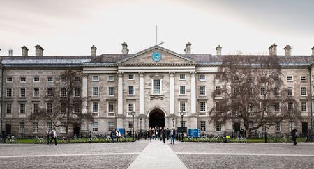 Dublin, Ireland - February 11, 2019: People walking in the courtyard of Trinity College in the city center on a winter dayのeditorial素材