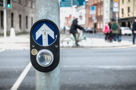 button to activate pedestrian crossing on the road on a pedestrian crossing in the city center on a...