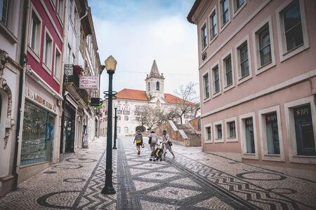 Aveiro, Portugal - May 7, 2018: People walking in a shopping street in the historic city center on a spring dayのeditorial素材