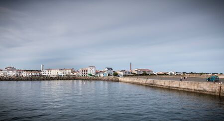Ile d Yeu, France - September 16, 2018: View of the bridge of a ferry that enters the harbor of the island of Yeu where travelers are sitting to admire the show on a summer dayのeditorial素材