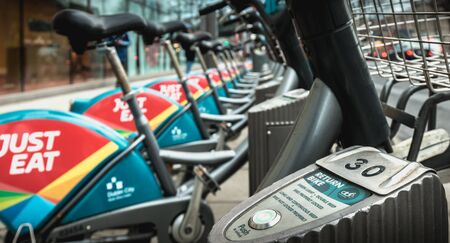 Dublin, Ireland - February 11, 2019: Detail of a shared public bike station Just Eat dublinbikes in...