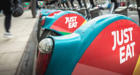 Dublin, Ireland - February 11, 2019: Detail of a shared public bike station Just Eat dublinbikes in the city center on a winter dayのeditorial素材