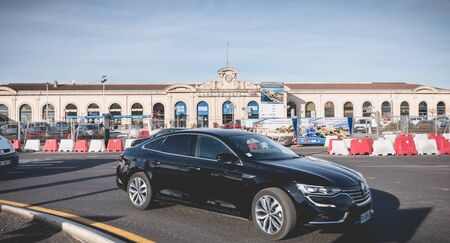 Sete, France - January 4, 2019: Bus and car traffic in front of the SNCF train station in the city center on a winter dayのeditorial素材