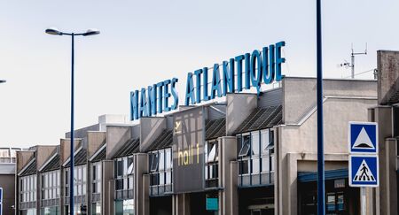 Nantes, France - August 7, 2018: view of the facade of Nantes Atlantique International Airport where travelers are walking on a summer dayのeditorial素材