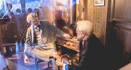 Paris, France - October 8, 2017: Gustave Eiffel and Thomas Edison wax figure in office is located to...