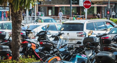 Irun, Spain - April 27, 2018: Motorcycle and taxis parking near town hall in the city center on a spring dayのeditorial素材