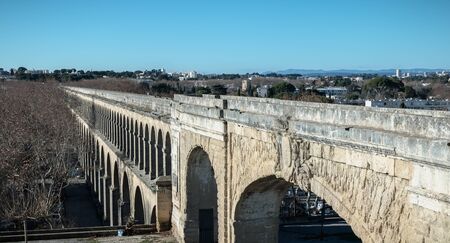 Montpellier, France - January 2, 2019: architecture detail of Saint-Clement aqueduct dating from 1766 where people are walking on a winter dayのeditorial素材