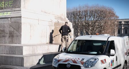 Montpellier, France - January 2, 2019: city employee who cleans the statue of Louis XIV degraded by graffiti overnight in the Promenade Peyrou a winter dayのeditorial素材