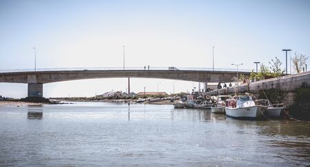 Tavira, Portugal - May 3, 2018: Small fishing boats docked in the port of Tavira on a spring dayのeditorial素材