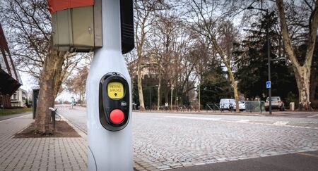 Strasbourg, France - December 28, 2017: pedestrian crosswalk signal button on the street side on a...