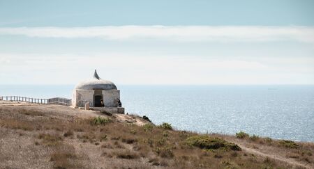 Cape Espichel near Sesimbra, Portugal - August 8, 2018: Architectural detail of the Cape Espichel sanctuary on a summer day. The Baroque church is built between 1701 and 1707 in memory of the Holy Mary in 1410のeditorial素材