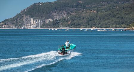 Setubal, Portugal - August 8, 2018: Boat sailing on a sunny day in Setubal Bay on a summer dayのeditorial素材