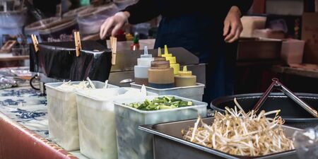 Dublin, Ireland - February 16, 2019: Live food stall where a cook prepares a meal in front of his client in the Temple Bar district on a winter dayのeditorial素材