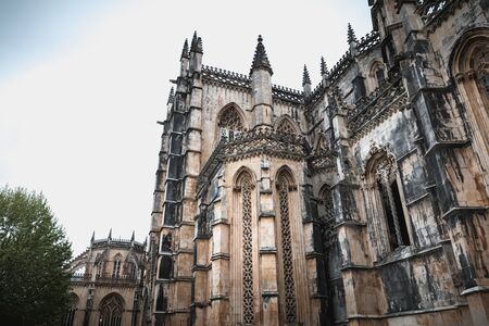 Batalha, Portugal - April 13, 2019: Architectural detail of the Monastery of Santa Maria da Vitoria...