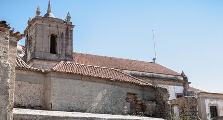 Cape Espichel near Sesimbra, Portugal - August 8, 2018: Architectural detail of the Cape Espichel sanctuary on a summer day. The Baroque church is built between 1701 and 1707 in memory of the Holy Mary in 1410のeditorial素材