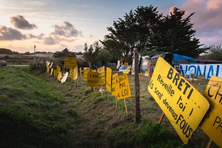 Bretignolles sur Mer, France - October 9, 2019: Set of yellow sign on a protest zone in an area to...