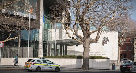 Dublin, Ireland - February 13, 2019: person walking in front of The Criminal Courts of Justice in the city center on a winter dayのeditorial素材