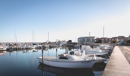 Marseillan, France - January 3, 2019: view of a small port in the south of France in Marseillan village where are moored small pleasure boats on a winter dayのeditorial素材