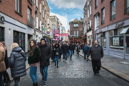 Dublin, Ireland - February 16, 2019: Temple Bar District - street atmosphere in the famous Irish pub district Temple Bar where people are walking on a winter dayのeditorial素材