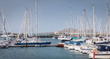 Howth near Dublin, Ireland - February 15, 2019: view of the marina of the city where are parked tourist boats on a winter dayのeditorial素材