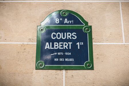 Paris, France - October 7, 2017: street sign on a stone wall indicating the 8th arrondissement of Paris - Albert 1st course 1875-1934 King of the Belgians on a fall dayのeditorial素材