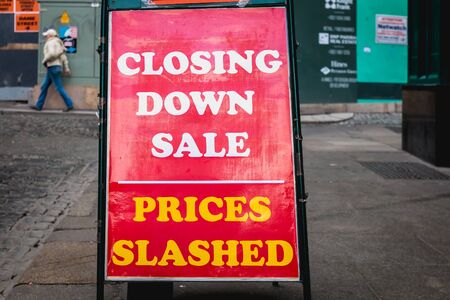 Dublin, Ireland - February 16, 2019: Closing Down Sale - Prices Slashed - on a street sign outside a...