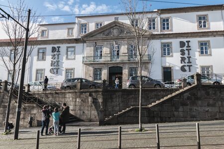 Porto, Portugal - November 30, 2018: Storefront and architectural detail of District - Offices and...