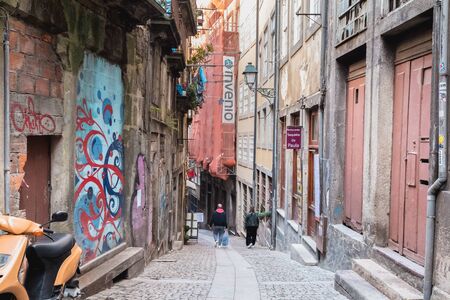 Porto, Portugal - November 30, 2018: Architecture detail and street atmosphere in the historic city center where people walk on a winter dayのeditorial素材