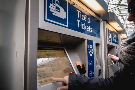 Dublin, Ireland - February 15, 2019: Passengers buying a ticket in the Connolly DART train station...