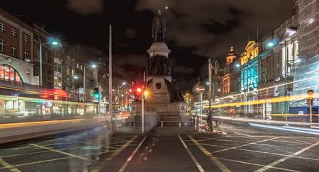 Dublin, Ireland - February 15, 2019: street atmosphere and architectural detail at night in the historic city center where people walk on a winter eveningのeditorial素材
