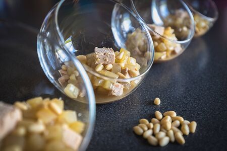 Verrine of pear foie gras and pine nuts in French cuisine