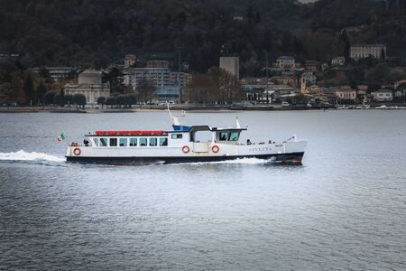 Como, Italy - November 4, 2017: Civetta tourist transport boat sailing on Lake Como on an autumn dayのeditorial素材