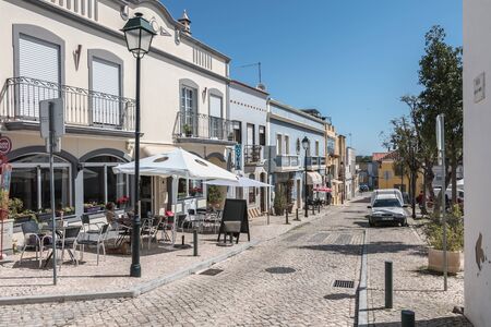 Moncarapacho, Portugal - May 4, 2018: Street atmosphere and architecture typical of a small town in the Algarve where people are walking on a spring dayのeditorial素材