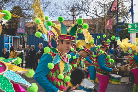 Loule, Portugal - February 25, 2020: percussionists parading in the street accompanying dancers in...