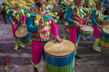 Loule, Portugal - February 25, 2020: percussionists parading in the street accompanying dancers in...