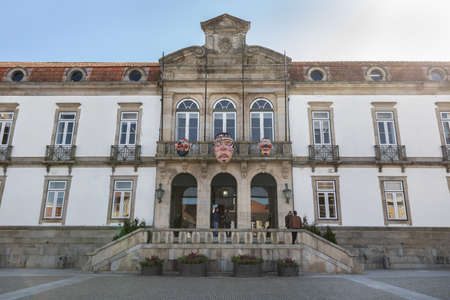 Ovar, Portugal - February 18, 2020: detail of architecture of the town hall in the historic city center where people walk on a winter dayのeditorial素材