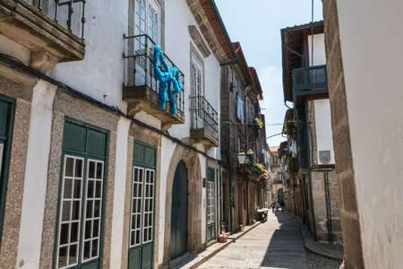 Guimaraes, Portugal - May 10, 2018: Architecture detail of houses typical of the small streets of...