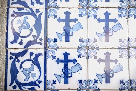 Tiles with geometric and religious motifs. Decoration with the typical Portuguese tiles (white and blue) inside a church in Portugalの写真素材