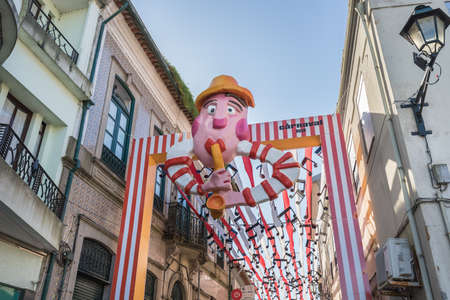 Ovar, Portugal - February 18, 2020: architectural detail of the typical houses of the city decorated for the carnival where people are walking on a winter dayのeditorial素材