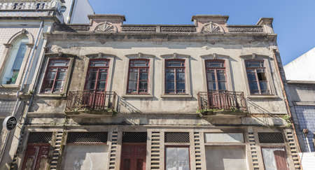Ovar, Portugal - February 18, 2020: small ruined apartment building in the city center on a winter dayのeditorial素材