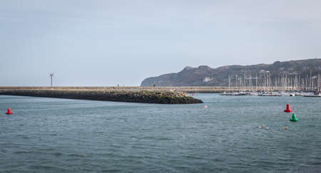 Howth near Dublin, Ireland - February 15, 2019: view of the fishing port of the city where are parked professional fishing boats on a winter dayのeditorial素材