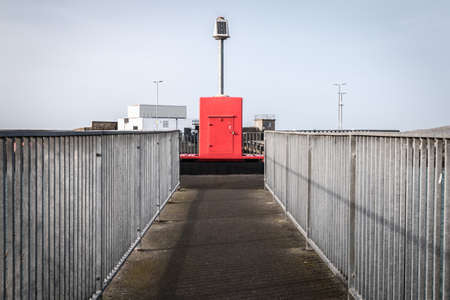 Howth near Dublin, Ireland - February 15, 2019: Illuminated signal for boat guidance at the entrance...