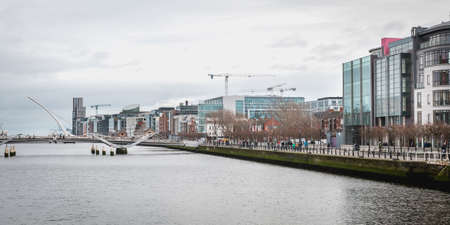 Dublin, Ireland - February 12, 2019: mix of modern and old architecture along the Liffey River in the city center on a winter dayのeditorial素材