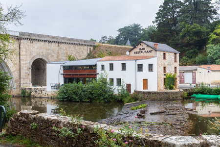 Rocheserviere, Pays de la Loire, France - September 21, 2020: architectural detail of the restaurant Le Moulin, by the La Boulogne river on an autumn dayのeditorial素材