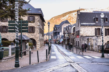 Saint-Lary-Soulan, France - December 26, 2020: Main street of famous ski resort where people are walking on a winter dayのeditorial素材