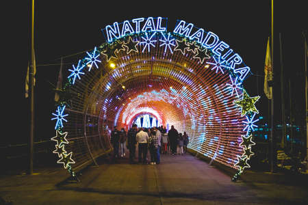Funchal, Madeira Island, Portugal - December 26, 2021: People walking in the marina decorated for Christmas for the holiday seasonのeditorial素材
