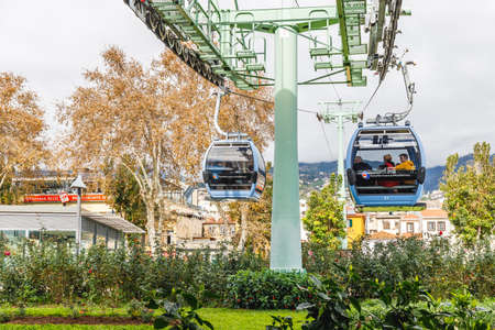 Funchal, Madeira, Portugal - December 27, 2021: Street atmosphere around the Funchal-Monte urban cable car where people are walking on a winter dayのeditorial素材